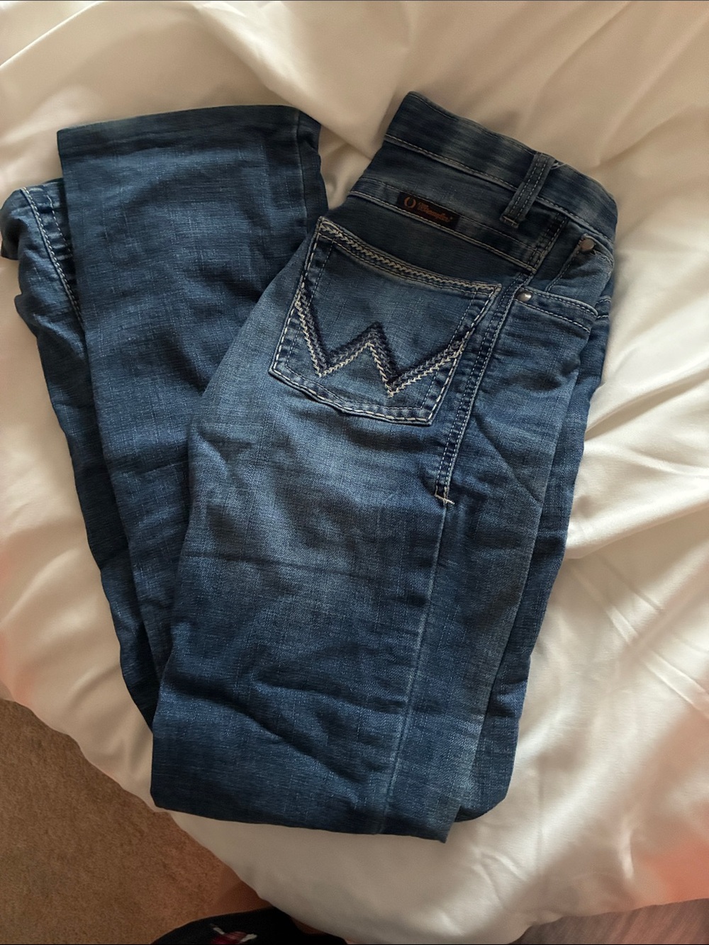Wrangler Dark Blue Straight Leg Jeans

They’ve been hemmed to a 32 inch inseam